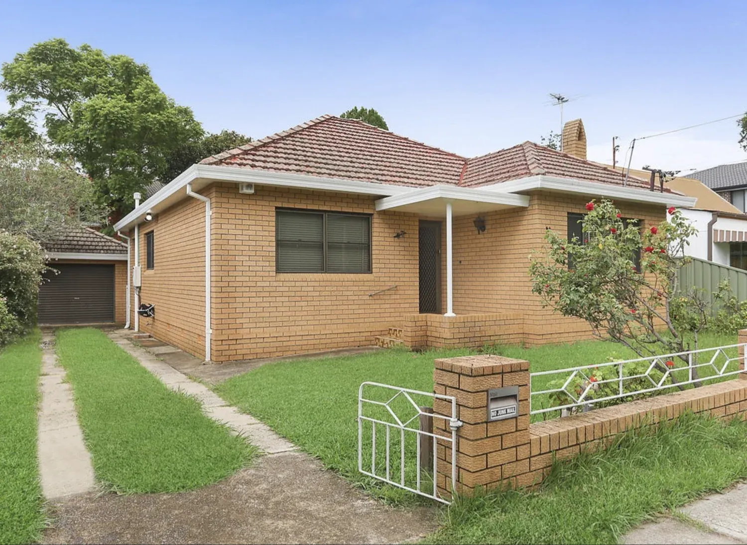 Exterior of the North Parramatta home with a front garden and garage